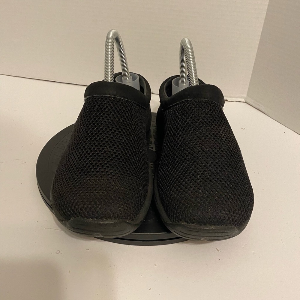 Women black Merrell clogs slides in good condition.